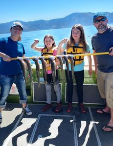 Four people enjoying a fishing trip in CA