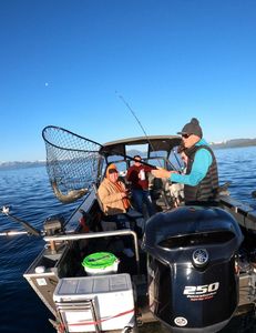 Three people fishing at Tahoe Vista