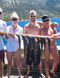 Three people fishing in CA