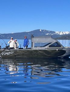 Three people enjoying fishing trip in CA