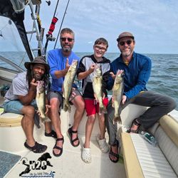 Four anglers fishing at the lakeside in Marblehead