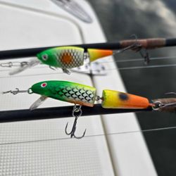 Two colorful fishing lures with hooks displayed on boat deck at Lakeside Marblehead OH