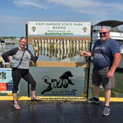 Three anglers enjoying a lakeside fishing trip at Lakeside Marblehead