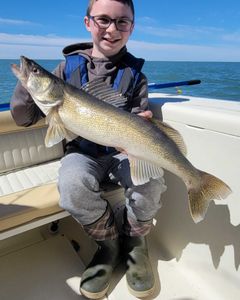 A person fishing on the lakeside in Marblehead