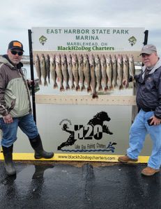 A couple enjoying a fishing trip at the lakeside in Marblehead