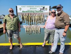 3 people enjoying a lakeside fishing trip in Lakeside Marblehead