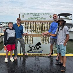 Four people enjoying a fishing trip at Lakeside Marblehead