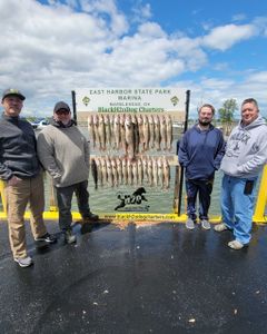Four people enjoying a day of fishing at Lakeside Marblehead