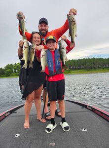 A group of 3 people fishing for largemouth bass in Winter Garden, FL