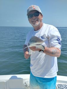 Angler with fishing rod standing in Panama City