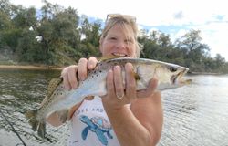 A person fishing in Florida with a 24-inch catch