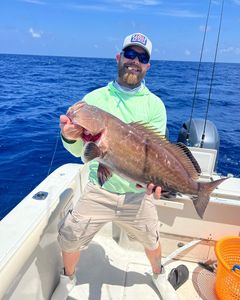 A fisherman with a 23-inch catch in FL