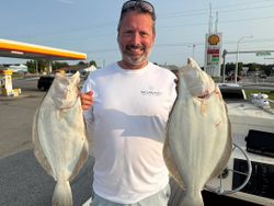 Two large California flounder caught during fishing trip in Rehoboth Beach DE