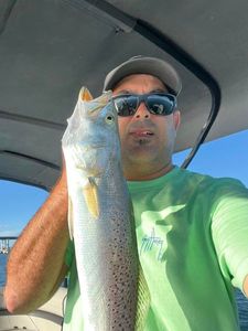 A lone angler fishing in the waters of South Padre Island