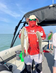 Two 18-inch fish caught during a cruises, fishing, and tours adventure in South Padre Island