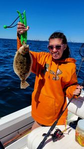 Angler holding a summer flounder fish in Atlantic City