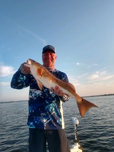 Angler posing with a 27-inch fish in Milton