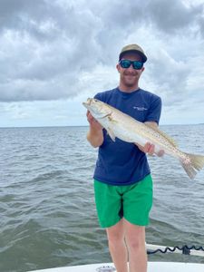 A lone angler reeling in a big catch in FL