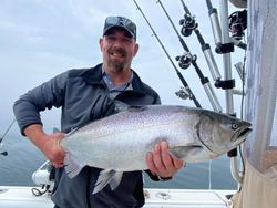 Angler catches a large lake trout in NY