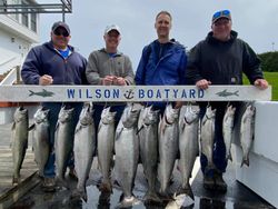 A group of 4 people fishing for 10 tarpon fish in Wilson
