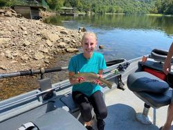 Angler catching a fish in Gassville