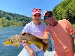 Two anglers fishing in AR with a big catch