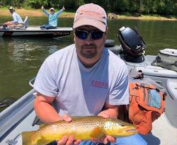 Angler holding a large Atlantic Salmon in Gassville