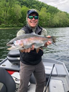 Angler holding a rainbow trout in Gassville