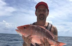 A single grey snapper fish caught on a fishing trip in Carolina Beach