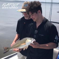 A photograph of two people fishing in Georgia