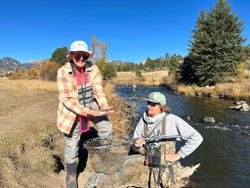 Two anglers enjoying fishing in CO