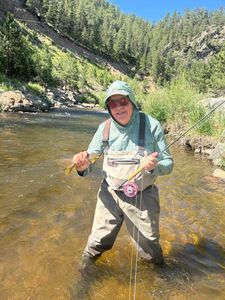 Lone fisherman casting a line in Colorado