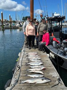 A group of 7 people fishing at Milwaukie