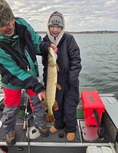 Northern Pike being caught by two people in Minneapolis