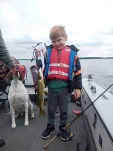 Northern pike fishing success on boat in Minneapolis Minnesota with catch displayed