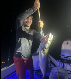 A single happy angler posing with their catch in Narragansett