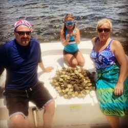 Three people standing in Steinhatchee