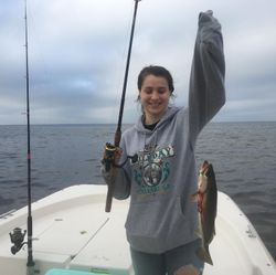 Angler catching a 15-inch fish in Steinhatchee