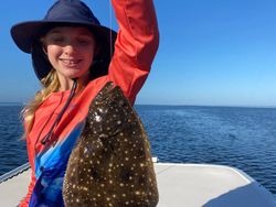 A summer flounder, an 11-inch fish, being caught while fishing in Florida