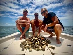 Three people enjoying a great fishing trip in Steinhatchee