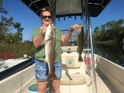 Two redfish and spotted weakfish, 25 inches long, caught while fishing in FL