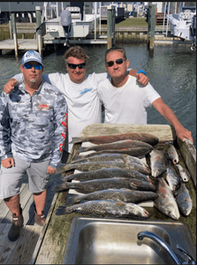 Three people fishing at Atlantic Beach