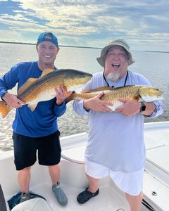 Two redfish caught during an Atlantic Beach fishing trip