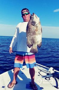 Angler with Tripletail fish catch in Naples, Florida