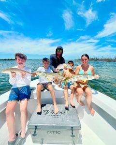 A group of 5 people fishing for 4 snook and redfish in FL