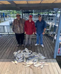 Three people fishing in Quinlan
