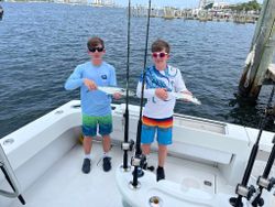Two anglers enjoying a fishing trip in Destin