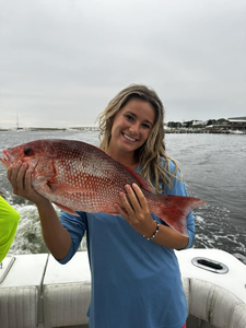 Fisherman with a single 20-inch catch in Destin