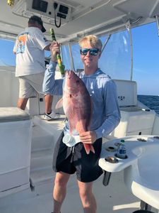 Anglers catching a 15-inch fish in Florida