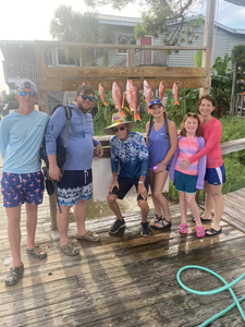 6 people fishing for 2 small fish in Destin